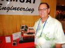 Jerry Buxton, N0JY, with a model of a Fox Series CubeSat at Dayton Hamvention 2015. 